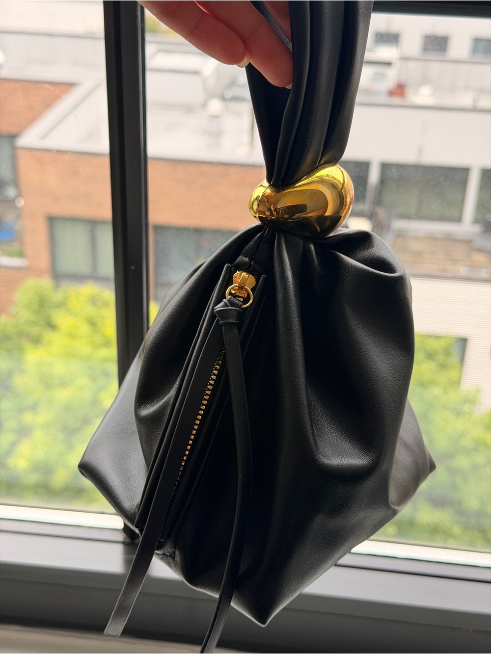 Elegant Black Handbag with Gold Accent